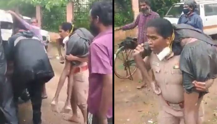 /woman-police-inspector-carries-unconscious-man-on-her-shoulders-amid-chennai-rain