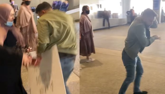 man-greets-mother-at-airport-and-gets-slap