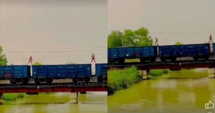 a practice performance of two young men in their underwear atop a moving goods train; The video goes viral; Social media calls for action against youth