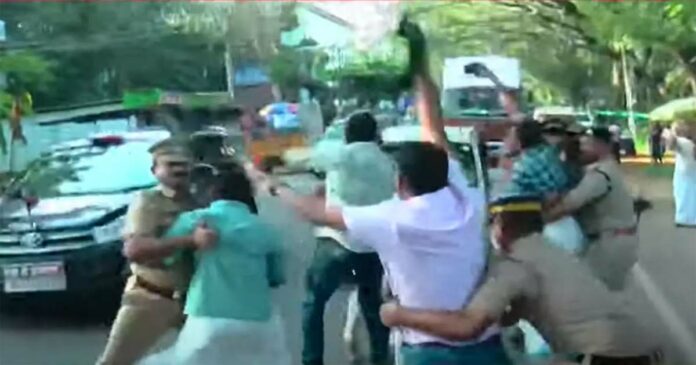 Youth Congress workers again use black flag against Chief Minister in Malappuram. The activists who rushed towards the convoy were later arrested and removed by the police