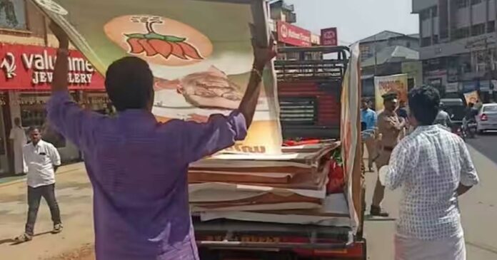 Police attempt to seize BJP's campaign boards in Wayanad! After an argument between K Surendran and the police, the boards were restored